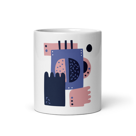 A white ceramic mug featuring a colorful abstract geometric print in shades of navy blue, dusty pink, and purple, set against a clean white background.